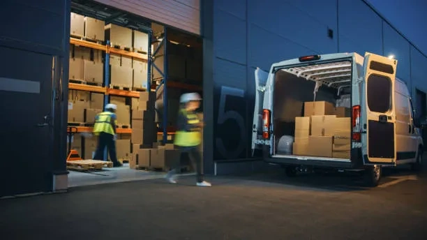 imgi 45 outside of logistics distributions warehouse diverse team of workers loading delivery truck