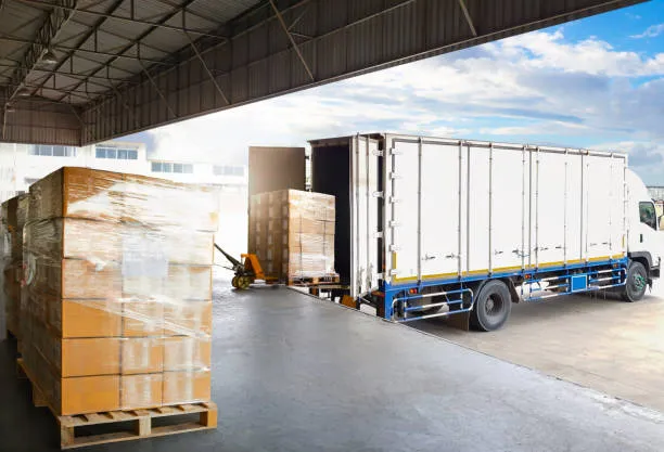 imgi 4 container trucks parked loading package boxes pallets at warehouse dock supply chain